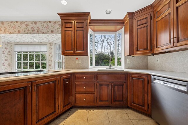 22 Druid Hill Rd, Port Jefferson, NY 11777 - kitchen featuring stainless steel dishwasher, a sink, light countertops, decorative backsplash, and light tile patterned flooring