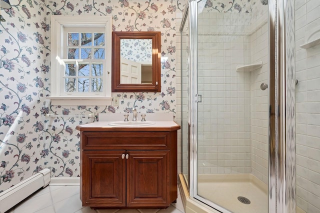 22 Druid Hill Rd, Port Jefferson, NY 11777 - full bath with wallpapered walls, a baseboard heating unit, a shower stall, tile patterned floors, and vanity