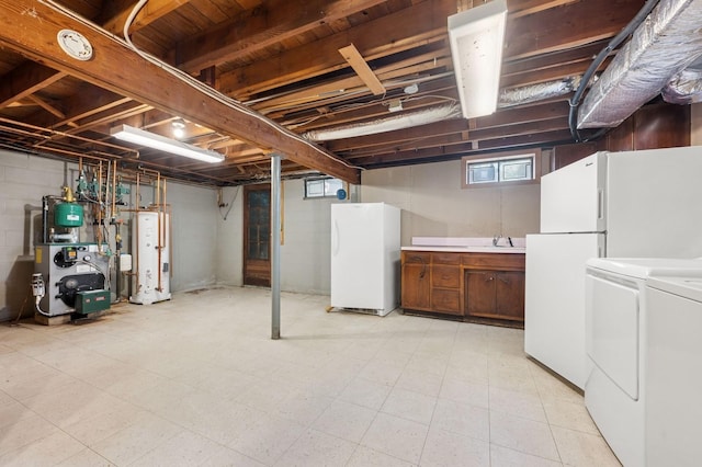 22 Druid Hill Rd, Port Jefferson, NY 11777 - below grade area featuring freestanding refrigerator, washer and clothes dryer, water heater, a heating unit, and a sink