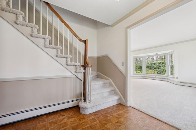 22 Druid Hill Rd, Port Jefferson, NY 11777 - stairway featuring a baseboard heating unit and carpet