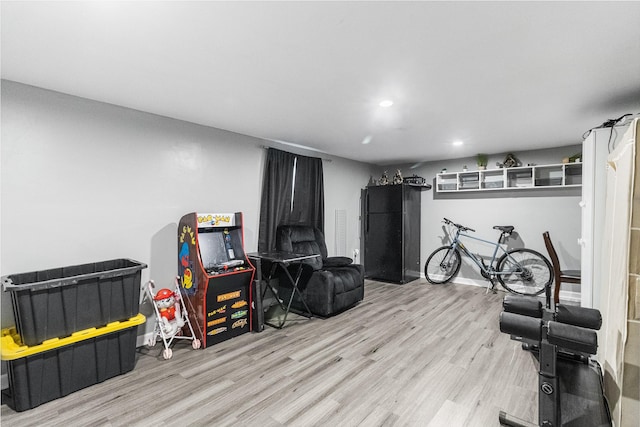 playroom featuring recessed lighting, baseboards, and wood finished floors