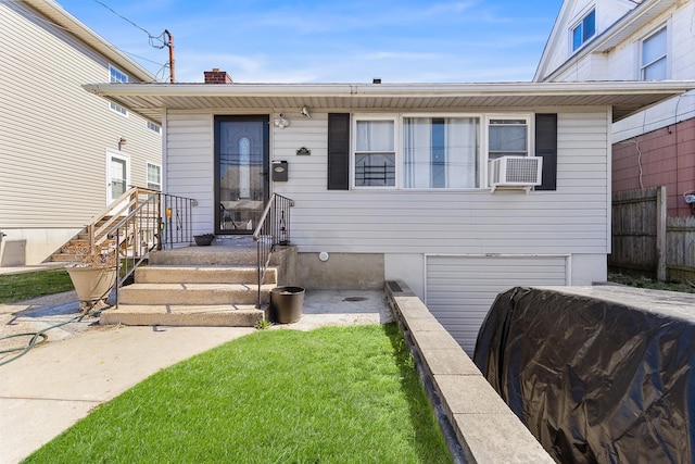 view of front of house with fence, cooling unit, a garage, and a chimney
