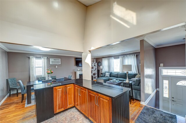 2892 Wilson Ave, Bellmore, NY 11710 - kitchen with ornamental molding, a wealth of natural light, an AC wall unit, and open floor plan