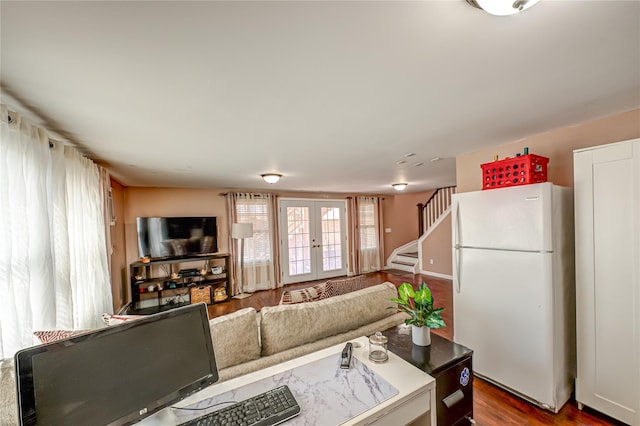 2892 Wilson Ave, Bellmore, NY 11710 - living room featuring stairs, wood finished floors, and french doors