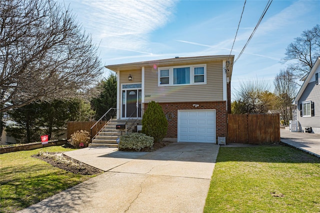 2892 Wilson Ave, Bellmore, NY 11710 - view of front of home featuring an attached garage, fence, brick siding, and concrete driveway