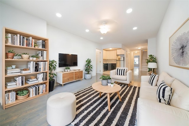 living room featuring wood finished floors and recessed lighting