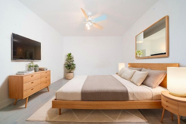 bedroom featuring baseboards and ceiling fan