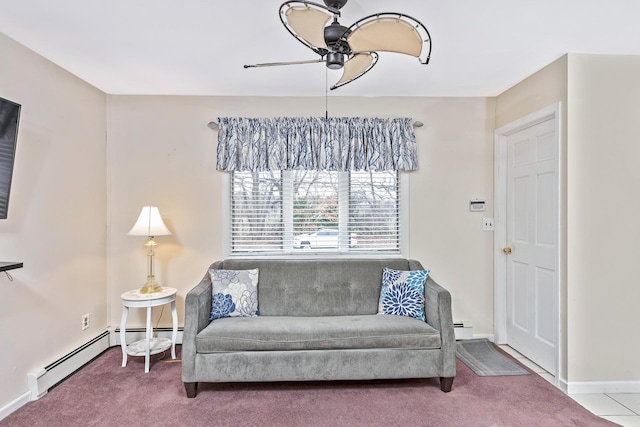 sitting room with a baseboard radiator, a ceiling fan, carpet, and baseboards