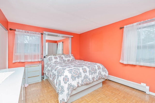 bedroom with baseboards and baseboard heating