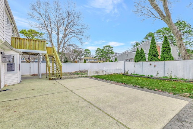 view of patio / terrace with a fenced backyard and stairway