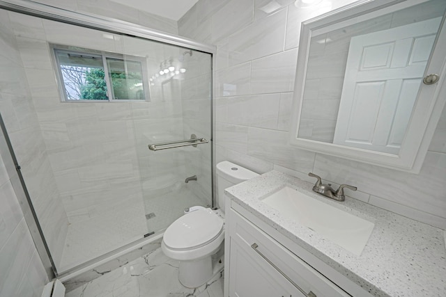 173 Bloomingdale Rd, Levittown, NY 11756 - bathroom featuring vanity, toilet, marble finish floor, tile walls, and a stall shower