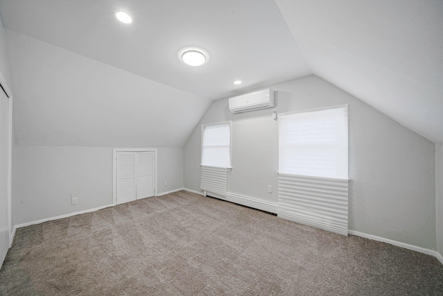 173 Bloomingdale Rd, Levittown, NY 11756 - additional living space featuring recessed lighting, carpet floors, lofted ceiling, a wall mounted air conditioner, and baseboards