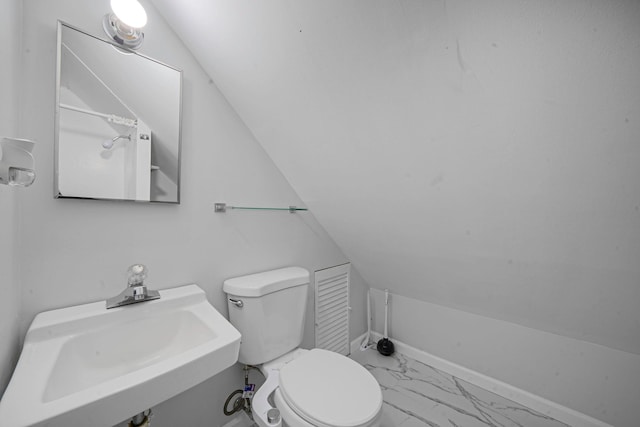 173 Bloomingdale Rd, Levittown, NY 11756 - bathroom with baseboards, toilet, lofted ceiling, marble finish floor, and a sink