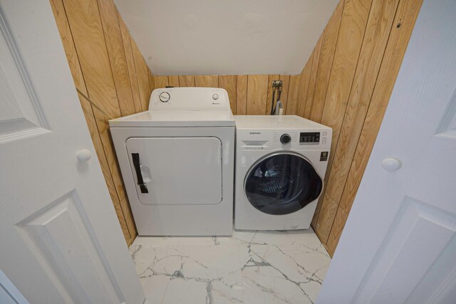 173 Bloomingdale Rd, Levittown, NY 11756 - clothes washing area featuring marble finish floor, laundry area, wooden walls, and washer and dryer