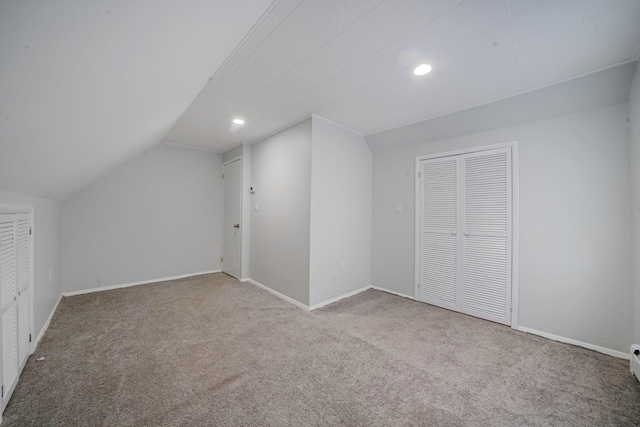 173 Bloomingdale Rd, Levittown, NY 11756 - additional living space with recessed lighting, baseboards, vaulted ceiling, and carpet floors