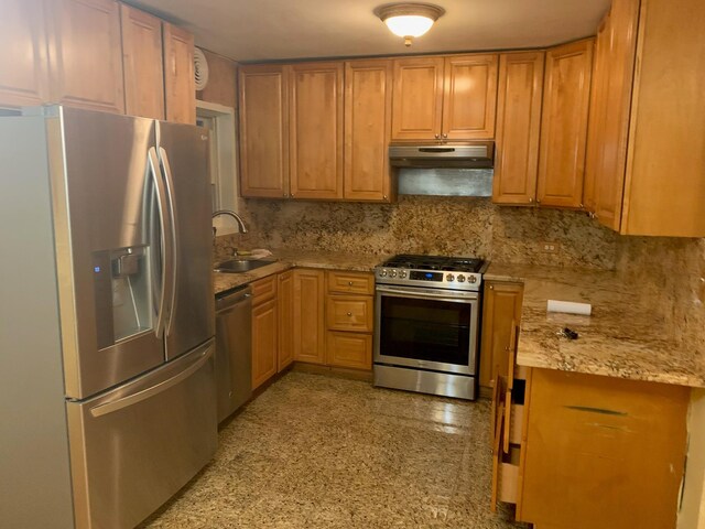 2443 Bouck Ave, Bronx, NY 10469 - kitchen featuring a sink, granite finish floor, tasteful backsplash, appliances with stainless steel finishes, and under cabinet range hood