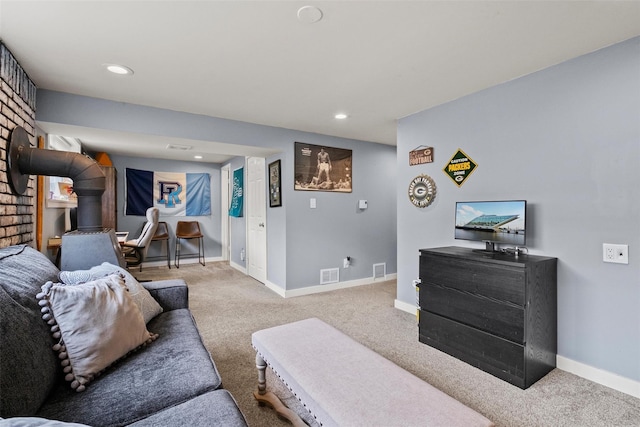 living area featuring recessed lighting, baseboards, visible vents, and carpet