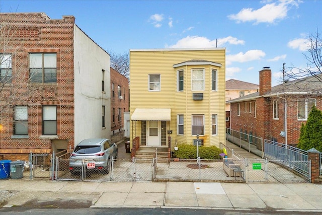 21-51 48th St, Astoria, NY 11105 - view of front facade with a gate and a fenced front yard