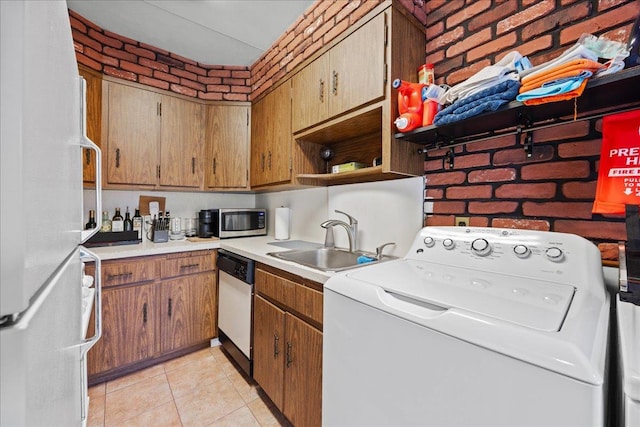 21-51 48th St, Astoria, NY 11105 - kitchen with washer / clothes dryer, stainless steel microwave, freestanding refrigerator, a sink, and dishwasher