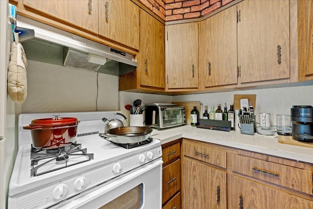 21-51 48th St, Astoria, NY 11105 - kitchen featuring gas range gas stove, light countertops, and ventilation hood