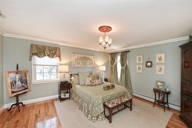 bedroom with crown molding, wood finished floors, and a baseboard heating unit