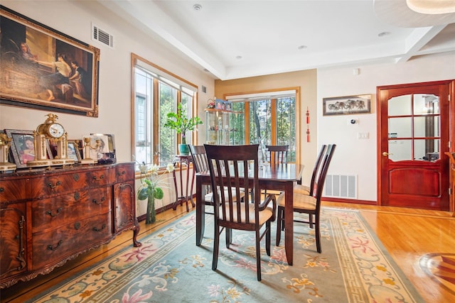 71-38 Harrow St, Forest Hills, NY 11375 - dining space featuring light wood-style floors and beam ceiling