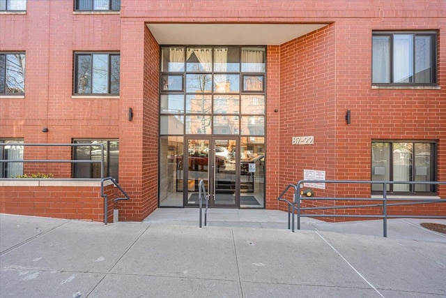 entrance to property with brick siding