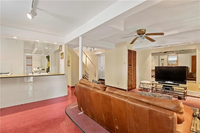 living area featuring recessed lighting, speckled floor, a ceiling fan, and stairway
