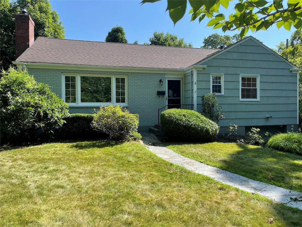2 Forest Pl, Larchmont, NY 10538 - single story home featuring a chimney, a front yard, and brick siding