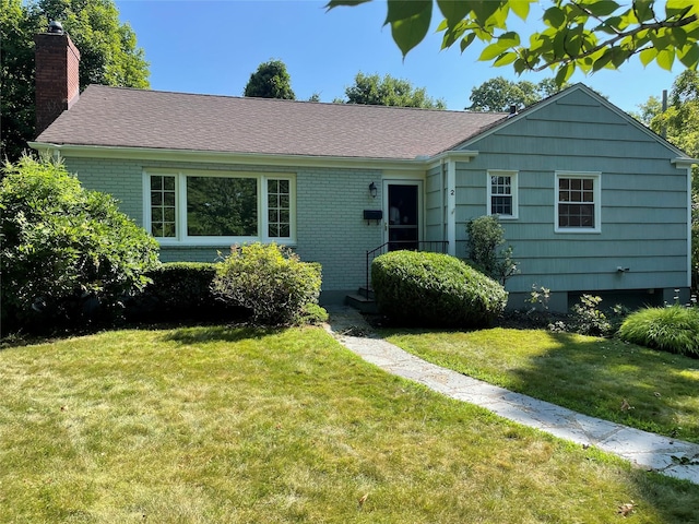 2 Forest Pl, Larchmont, NY 10538 - single story home featuring a chimney, a front yard, and brick siding