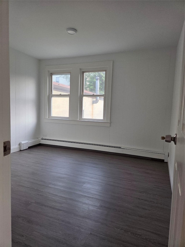 111 Washington St, Port Chester, NY 10573 - unfurnished room featuring dark wood-type flooring, baseboard heating, and baseboards