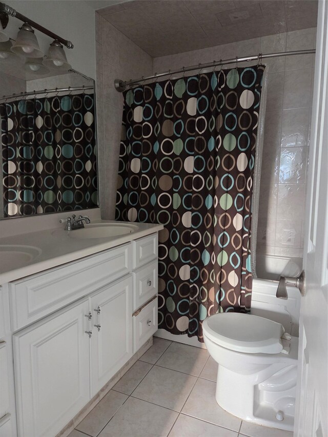 111 Washington St, Port Chester, NY 10573 - full bath featuring double vanity, tile patterned floors, and toilet