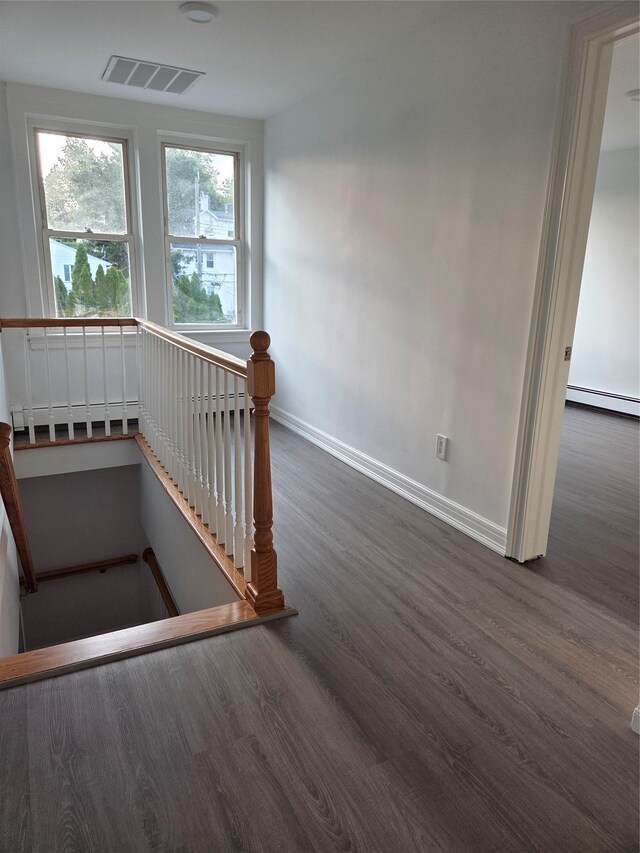 111 Washington St, Port Chester, NY 10573 - stairway with wood finished floors, baseboards, and baseboard heating