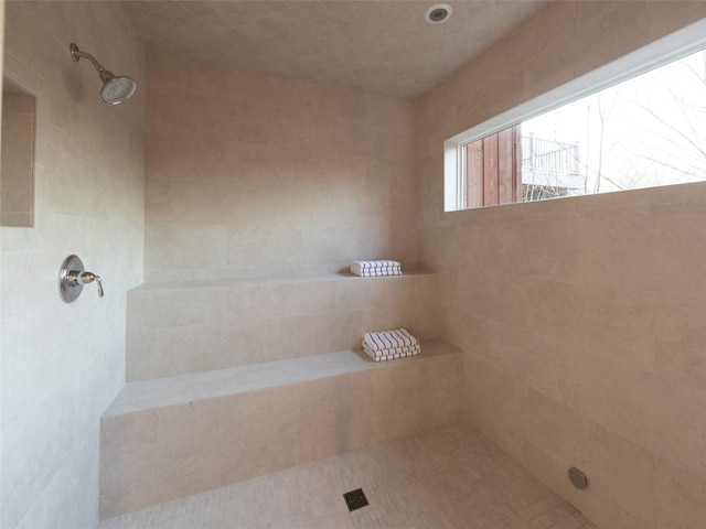 full bathroom with tiled shower
