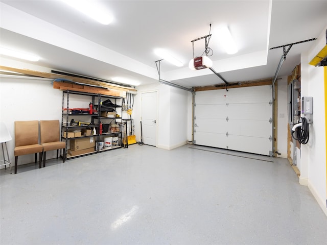 garage featuring baseboards and a garage door opener