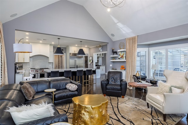 living area featuring high vaulted ceiling, recessed lighting, and light wood finished floors