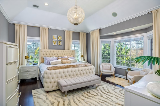 bedroom featuring dark wood-style flooring, visible vents, multiple windows, and a notable chandelier