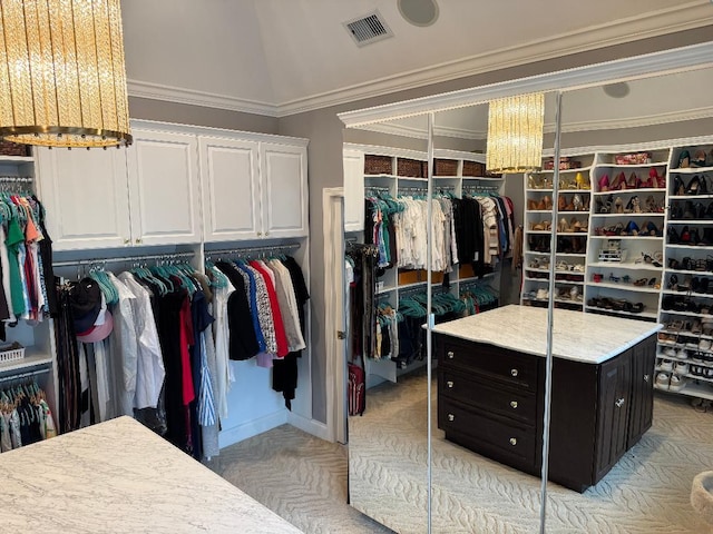 walk in closet with a notable chandelier and visible vents