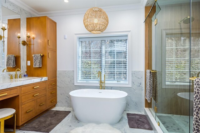 full bathroom with tile walls, a shower stall, vanity, and wainscoting