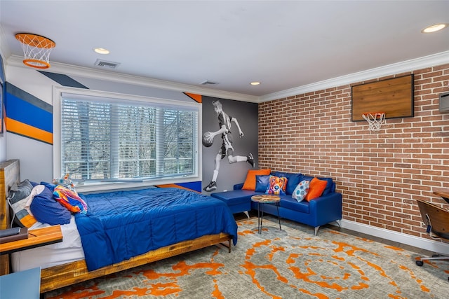 bedroom with brick wall, visible vents, and baseboards