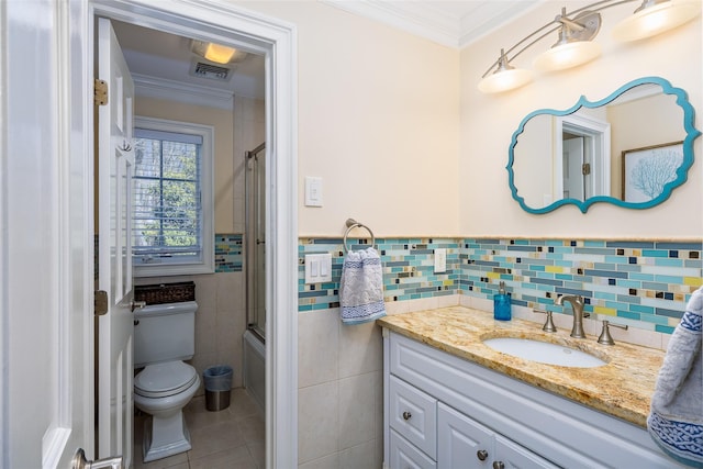 full bath with ornamental molding, visible vents, toilet, tile walls, and tile patterned floors
