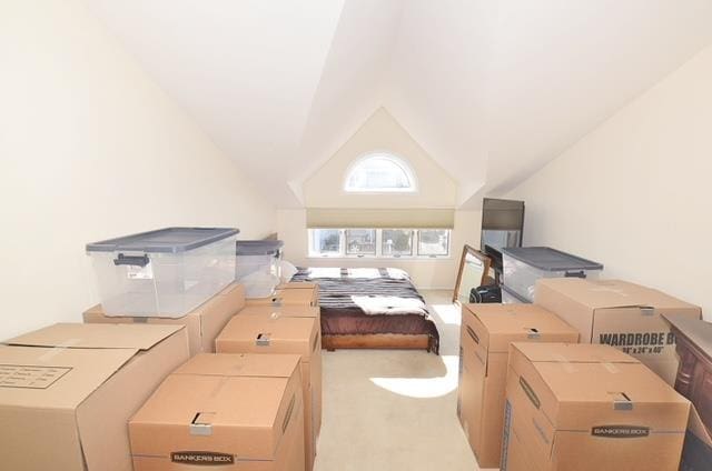 10 Windsor Ct, Amityville, NY 11701 - bedroom with lofted ceiling, washer / clothes dryer, carpet flooring, and refrigerator