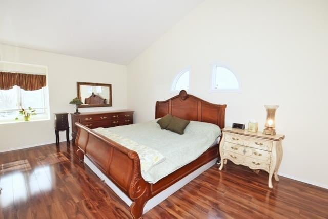 10 Windsor Ct, Amityville, NY 11701 - bedroom featuring lofted ceiling and dark wood-type flooring