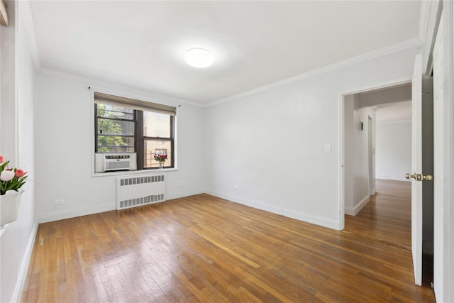 150-10 71st Ave Unit 3L, Flushing, NY 11367 - unfurnished room featuring radiator heating unit, hardwood / wood-style flooring, ornamental molding, baseboards, and cooling unit