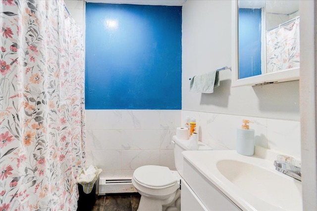 6 Farrington St, Newburgh, NY 12550 - bathroom featuring vanity, tile walls, a baseboard heating unit, toilet, and a wainscoted wall