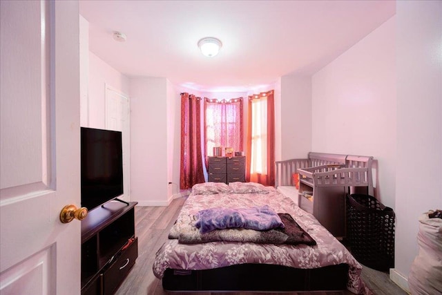 6 Farrington St, Newburgh, NY 12550 - bedroom featuring baseboards and wood finished floors