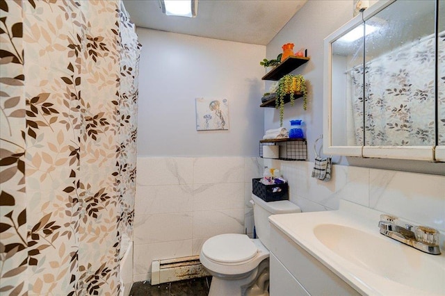 6 Farrington St, Newburgh, NY 12550 - bathroom featuring vanity, tile walls, toilet, a wainscoted wall, and baseboard heating