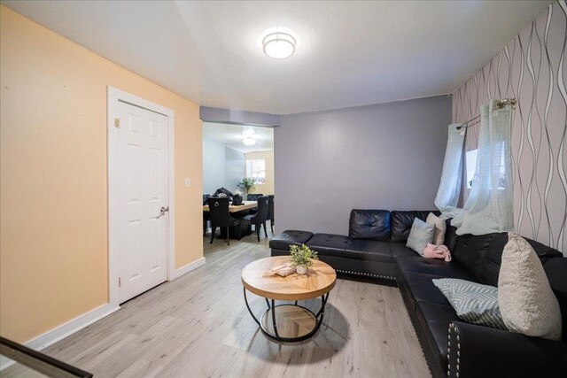 6 Farrington St, Newburgh, NY 12550 - living area with baseboards and light wood finished floors