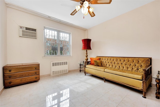 sitting room featuring baseboards, a wall mounted AC, radiator heating unit, and a ceiling fan