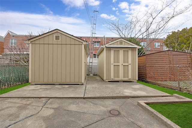 view of shed featuring a fenced backyard